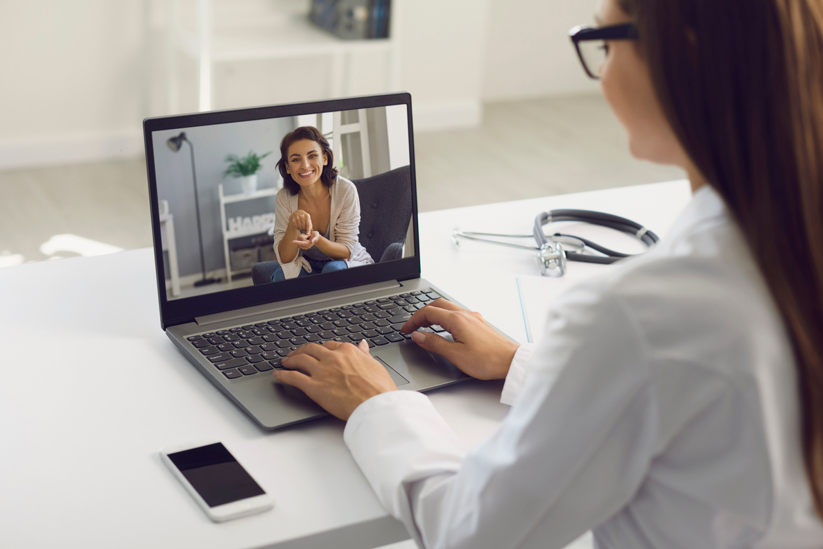 Young Woman Consulting with Doctor 